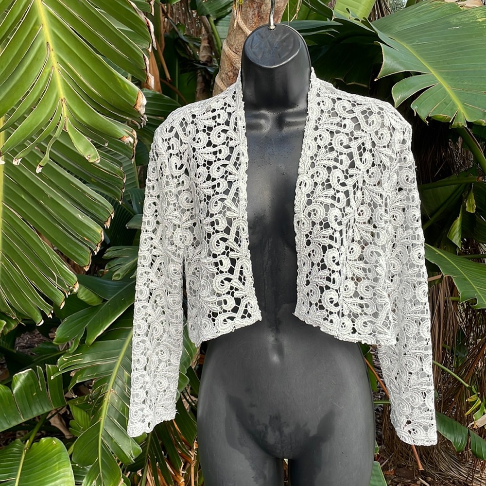 Marina. Silver lace crop jacket, or Bowlero.